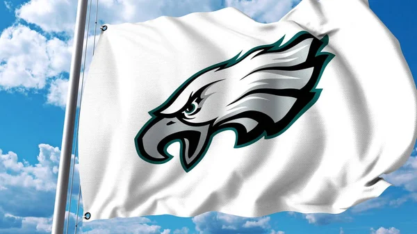 Viftande flagga med Philadelphia Eagles professionellt team logo. Redaktionella 3d-rendering — Stockfoto