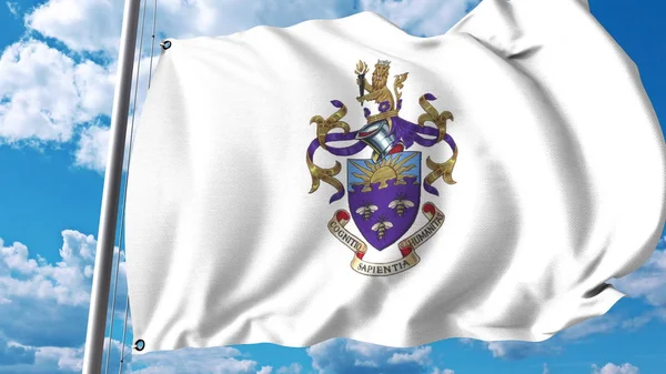 Wapperende vlag met het embleem van de Universiteit van Manchester. Redactioneel 3D-rendering — Stockfoto