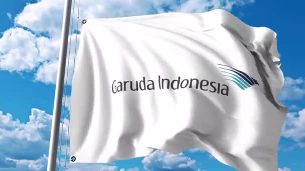 Bandera ondeante con logo Garuda Indonesia. Clip editorial 4K — Vídeos de Stock