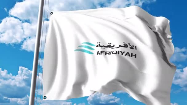 Wapperende vlag met Afriqiyah Airways logo. 4 k redactionele clip — Stockvideo