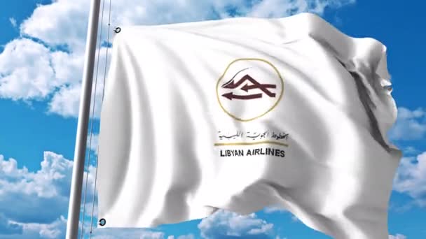 Размахивает флагом с логотипом Libyan Airlines. Редакционный клип 4К — стоковое видео