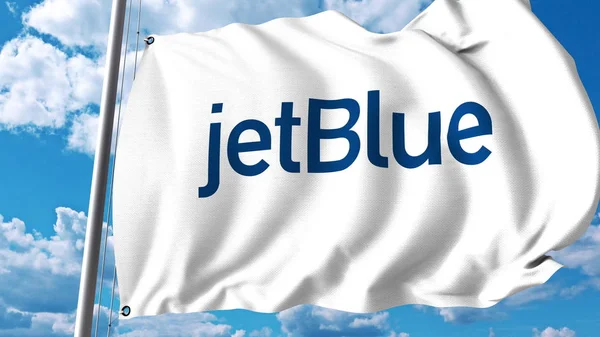 Розмахуючи прапором з логотипом Jetblue. 3D-рендерінг — стокове фото