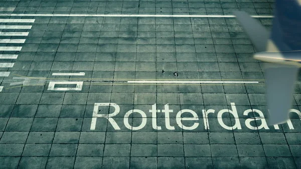 Aerial view of an airplane arriving to Rotterdam airport. Travel to Netherlands 3D rendering — Stock Photo, Image