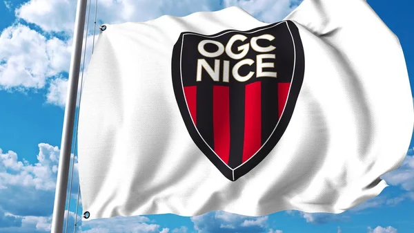 Bandiera sventolante con logo della squadra di calcio di Nizza. Rendering editoriale 3D — Foto Stock