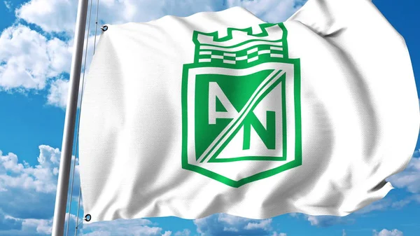 Wapperende vlag met Atletico Nacional voetbal club logo. Redactioneel 3D-rendering — Stockfoto