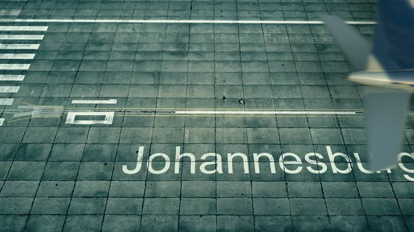 Пташиного польоту літака, які прибувають до аеропорту Йоганнесбурзі. Поїздки до Південної Африки 3d-рендерінг — стокове фото