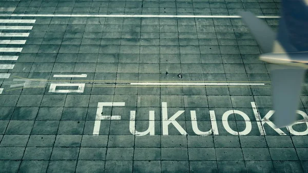 Vista aérea de un avión que llega al aeropuerto de Fukuoka. Viaje a Japón 3D renderizado — Foto de Stock