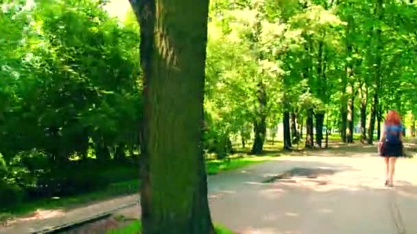 Unknown man cycling along park bike road — Stock Video