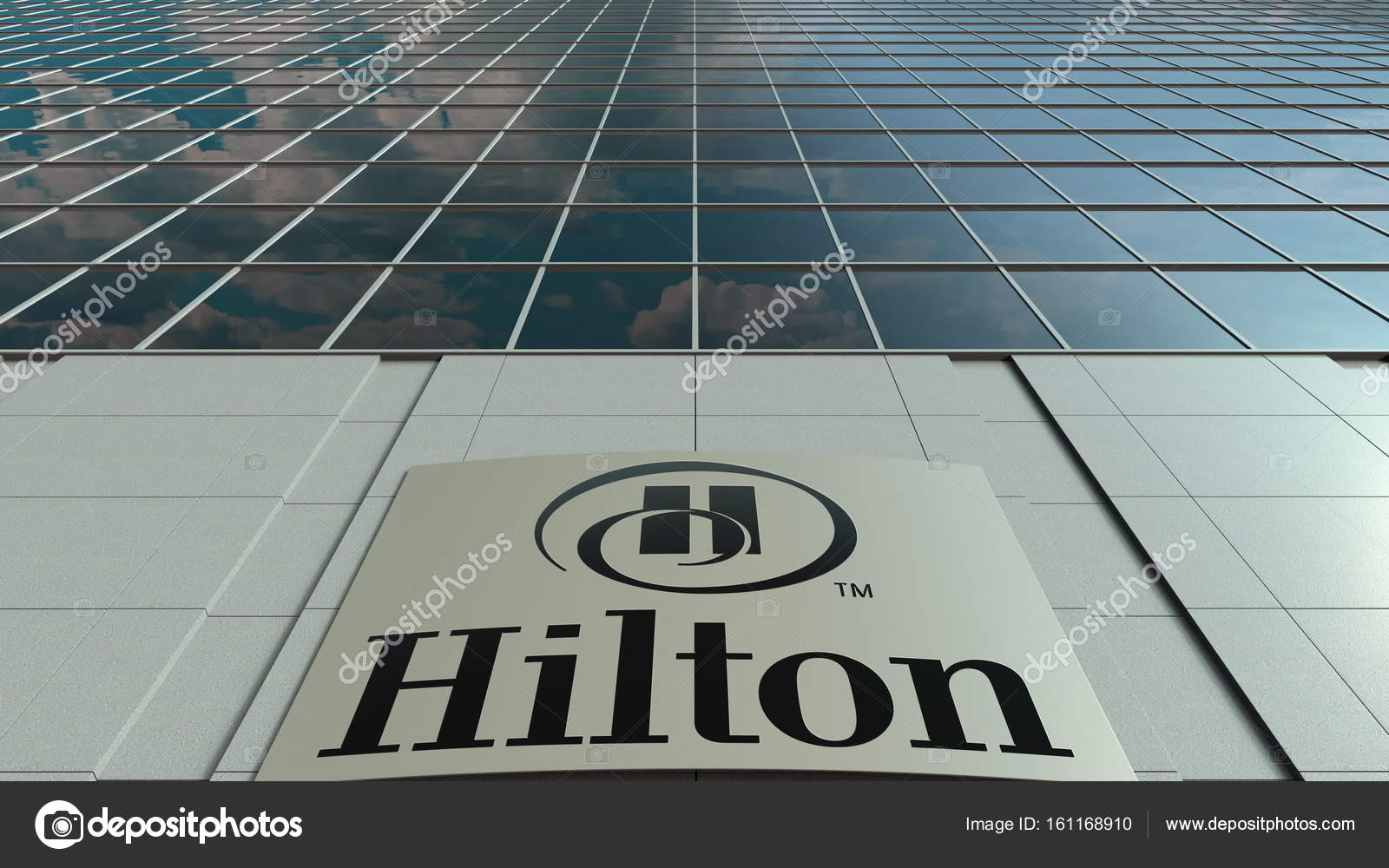 Signage board with Hilton Hotels Resorts logo. Modern office