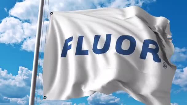 Macha flagą z logo Fluor Corporation. 4 k redakcji animacji — Wideo stockowe