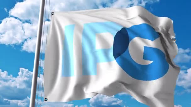 Waving flag with Interpublic Group Of Companies logo. 4K editorial animation — Stock Video