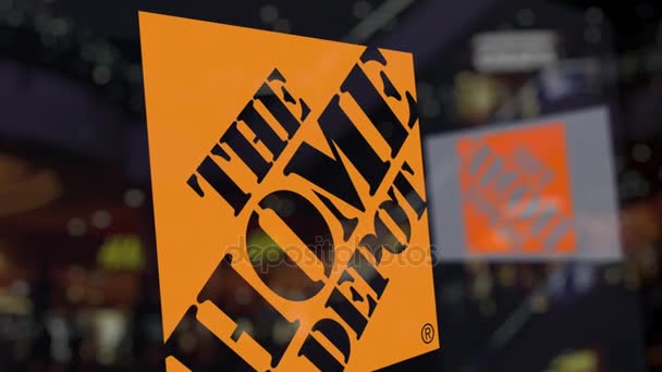 A Home Depot logó az üveg homályos üzleti központ ellen. Szerkesztői 3d-leképezés — Stock videók