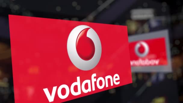 Logotipo de Vodafone en el vidrio contra el centro de negocios borroso. Representación Editorial 3D — Vídeo de stock