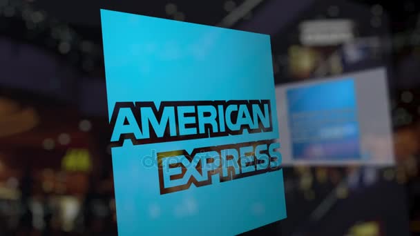 Логотип American Express на стекле против размытого бизнес-центра. Редакционная 3D рендеринг — стоковое видео