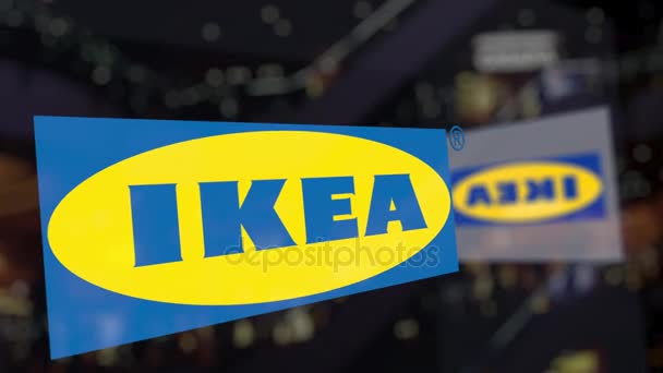 Logo IKEA na sklo proti rozmazané business centrum. Úvodník 3d vykreslování — Stock video