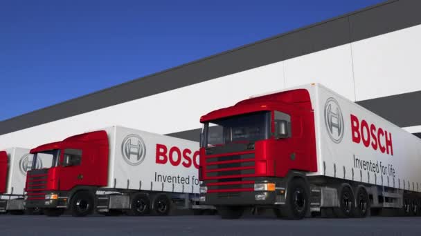 Ημι φορτηγών μεταφορών με το λογότυπο της Robert Bosch Gmbh φόρτωσης ή εκφόρτωσης στην αποβάθρα της αποθήκης, αδιάλειπτη βρόχο. Κινούμενα σχέδια σύνταξης 4k — Αρχείο Βίντεο