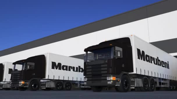 Freight semi trucks with Marubeni Corporation logo loading or unloading at warehouse dock, seamless loop. Editorial 4K animation — Stock Video