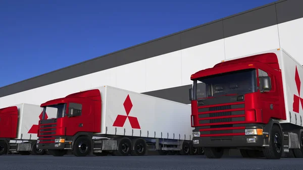 Frakt semi lastbilar med Mitsubishi logotyp lastning eller lossning på lager dock. Redaktionella 3d-rendering — Stockfoto