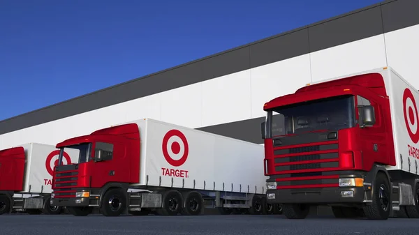 Грузовые полугрузовики с логотипом Target Corporation погрузка или разгрузка на складе док. Редакционная 3D рендеринг — стоковое фото