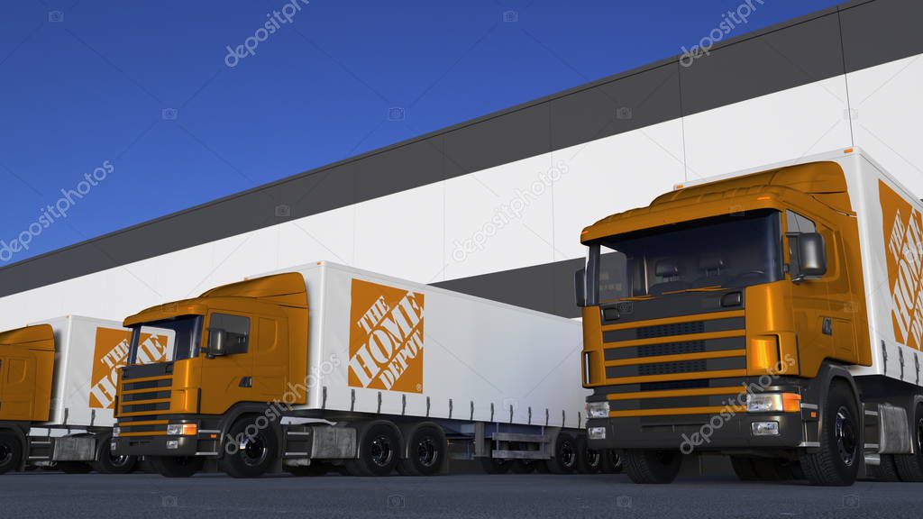 Freight semi trucks with The Home Depot logo loading or unloading at warehouse dock. Editorial 3D