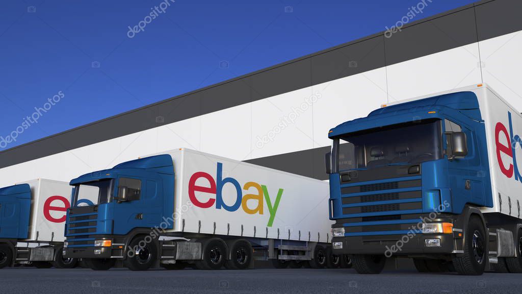 Freight semi trucks with eBay Inc. logo loading or unloading at warehouse dock. Editorial 3D