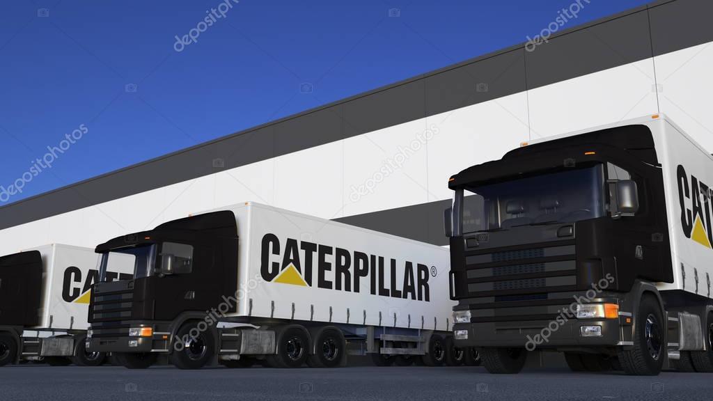 Freight semi trucks with Caterpillar Inc. logo loading or unloading at warehouse dock. Editorial 3D