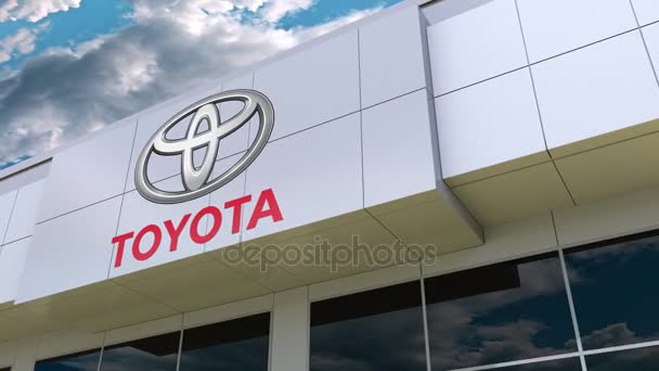 Toyota logo na fasádě moderní budovy. Úvodník 3d vykreslování — Stock video