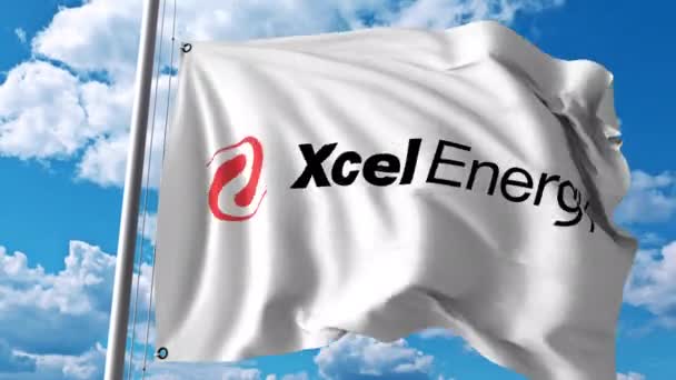 Drapeau ondulé avec logo Xcel Energy. Animation éditoriale 4K — Video