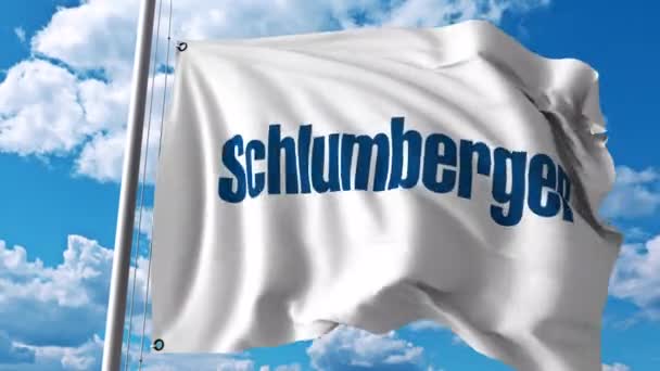 Bandiera sventolante con logo Schlumberger. Animazione editoriale 4K — Video Stock