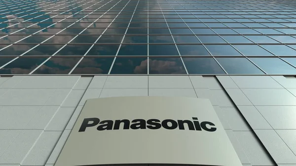 Tablero de señalización con el logotipo de Panasonic Corporation. Moderna fachada del edificio de oficinas. Representación Editorial 3D — Foto de Stock