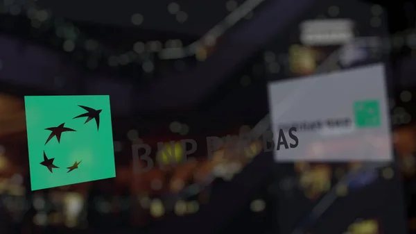 Logo BNP Paribas sul vetro contro il business center sfocato. Rendering editoriale 3D — Foto Stock