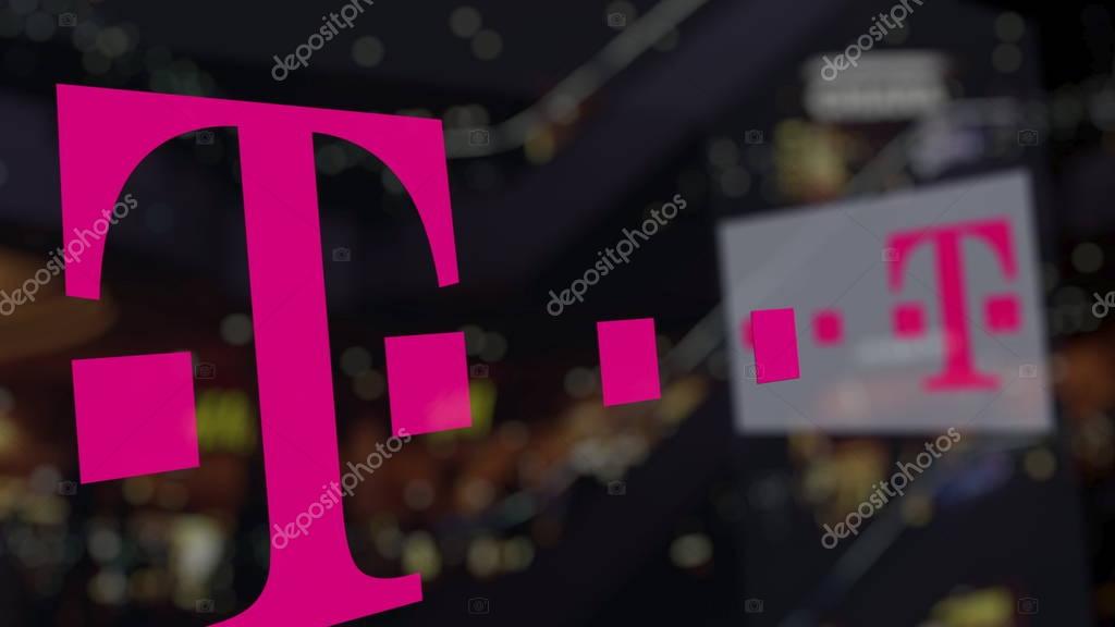T-Mobile logo on the glass against blurred business center. Editorial 3D