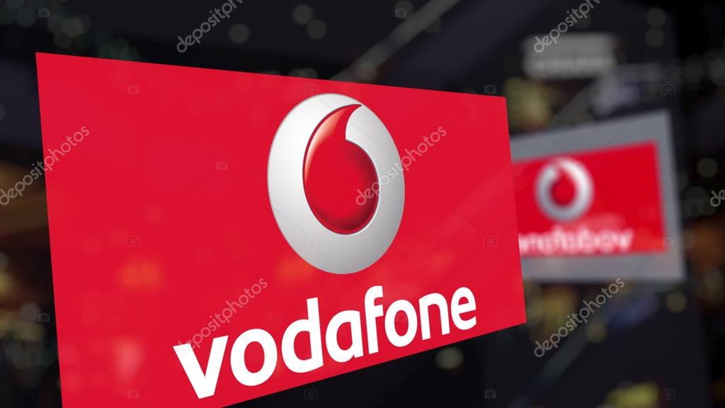 Vodafone logo on the glass against blurred business center. Editorial 3D