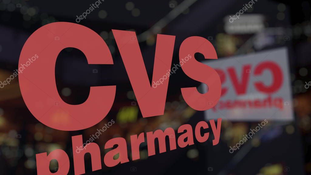 CVS Health logo on the glass against blurred business center. Editorial 3D