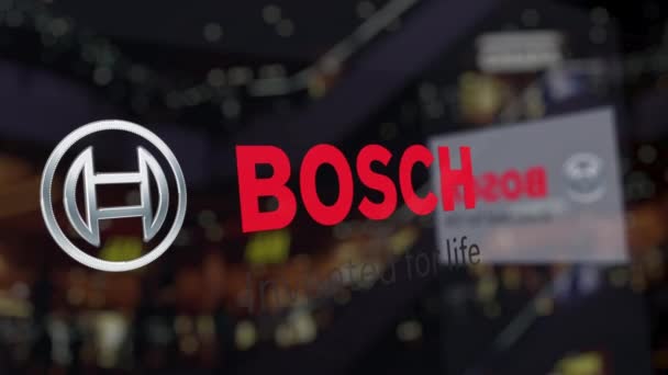 Logo Robert Bosch GmbH sur le verre contre le centre d'affaires flou. Editorial rendu 3D — Video