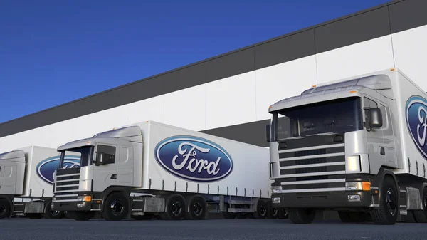Грузовые полугрузовики с логотипом Ford Motor Company погрузка или разгрузка на складе док. Редакционная 3D рендеринг — стоковое фото
