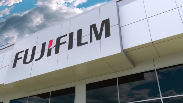 Логотип Fujifilm на фасаде современного здания. Редакционная 3D рендеринг — стоковое видео