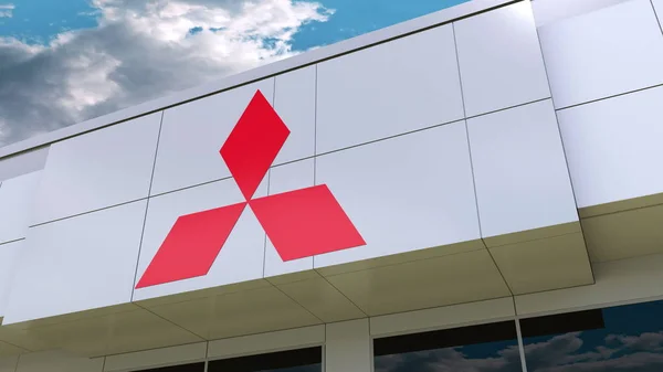 Logo Mitsubishi na elewacji budynku. Redakcji renderowania 3d — Zdjęcie stockowe