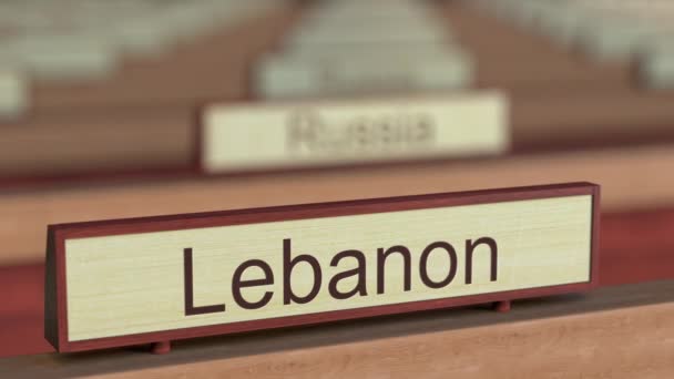 Líbano signo de nombre entre las diferentes placas de los países en la organización internacional. Renderizado 3D — Vídeo de stock