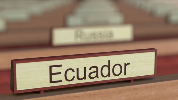 Ecuador name sign among different countries plaques at international organization. 3D rendering — Stock Photo, Image