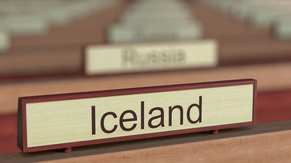 Iceland name sign among different countries plaques at international organization. 3D rendering — Stock Photo, Image