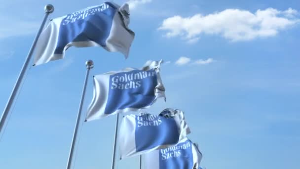 Ondeando banderas con el logotipo de Goldman Sachs contra el cielo, lazo sin costuras. Animación editorial 4K — Vídeo de stock