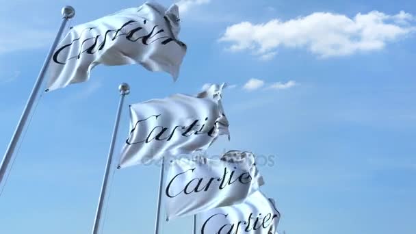 Wapperende vlaggen met Cartier logo tegen hemel, naadloze loops. 4 k redactionele animatie — Stockvideo