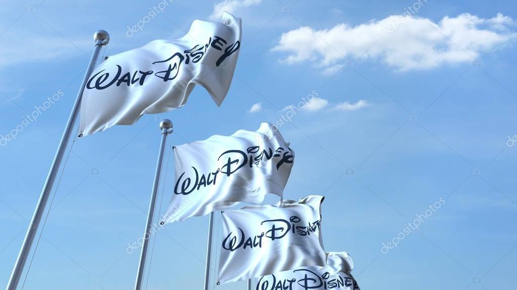 Waving flags with Walt Disney logo against sky, editorial 3D