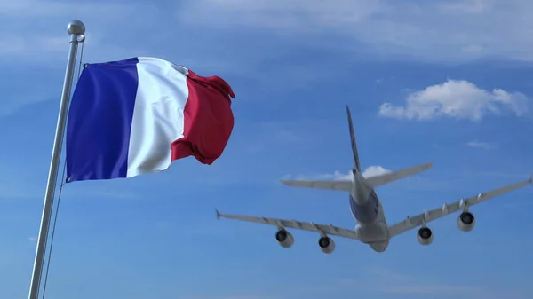 Aereo commerciale che atterra dietro la bandiera francese sventolante. Viaggio in Francia rendering 3D concettuale — Foto Stock