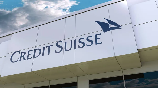 Credit Suisse Group logo on the modern building facade. Editorial 3D rendering Stock Photo