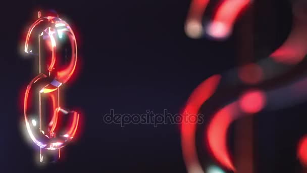 Rotating glass dollar signs against dark background — Stock Video