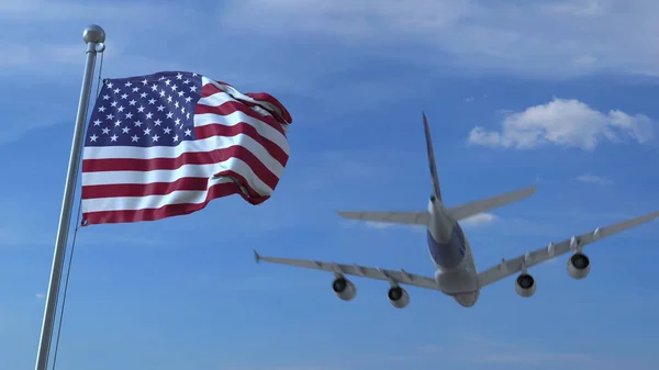 Commerciële vliegtuig landing achter de Amerikaanse vlag zwaaien. Reizen naar de Verenigde Staten conceptuele 3D-rendering — Stockfoto