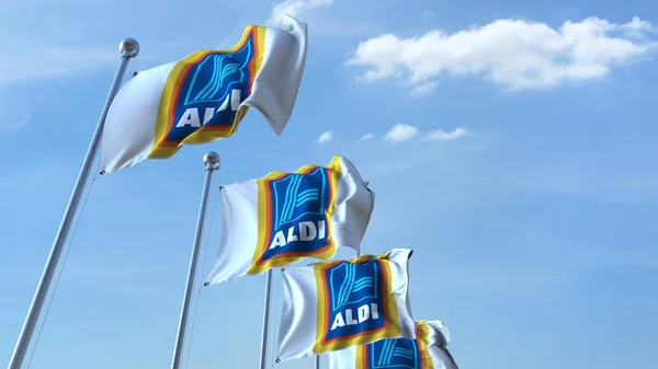 Bandiere sventolanti con logo Aldi contro il cielo, rendering editoriale 3D — Foto Stock