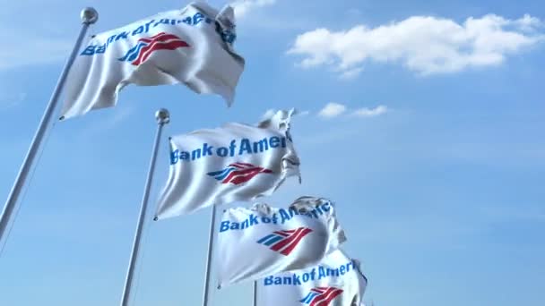 Vlající vlajky s logem Bank Of America proti obloze, bezešvé smyčka. 4 k redakční animace — Stock video